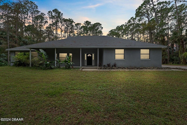 view of front of home featuring a lawn