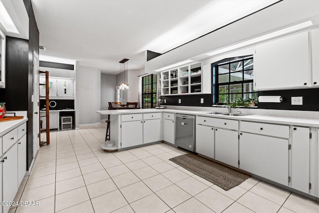 kitchen with white cabinetry, dishwasher, decorative light fixtures, and sink