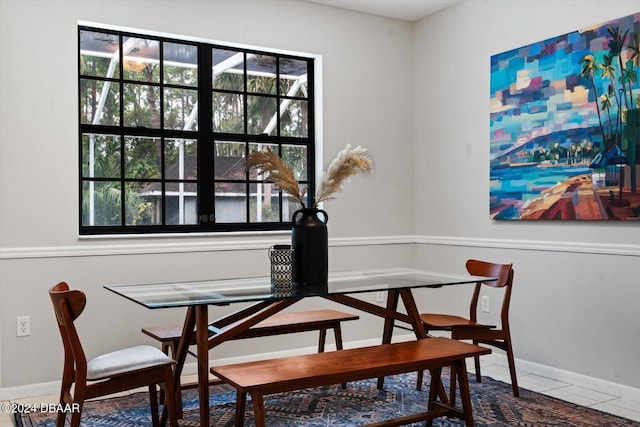 dining space with tile patterned floors