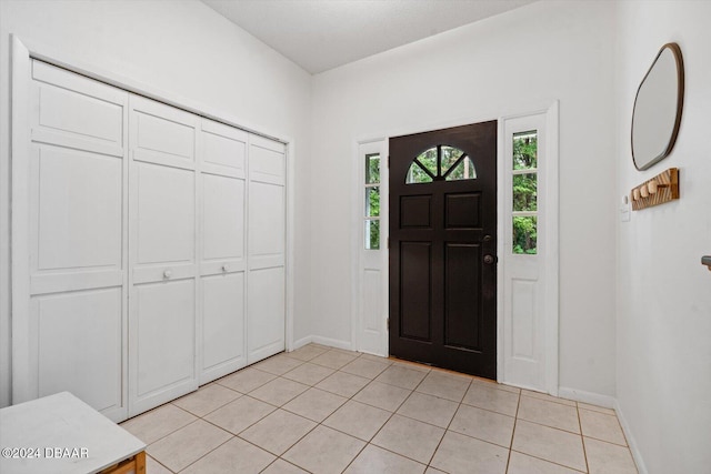 entryway featuring light tile patterned floors