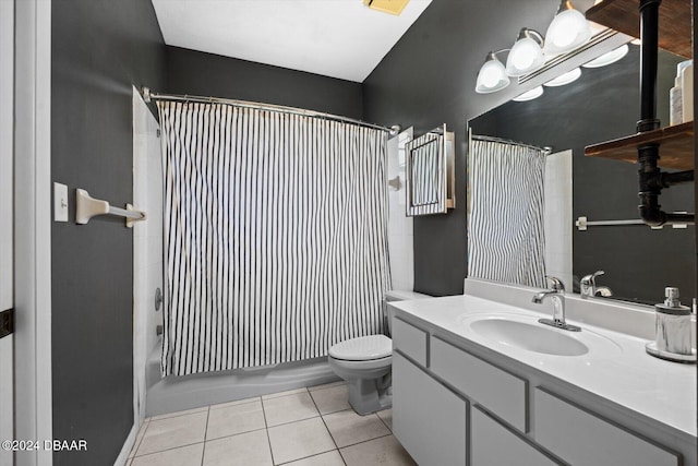 full bathroom featuring toilet, shower / bath combo, vanity, and tile patterned floors