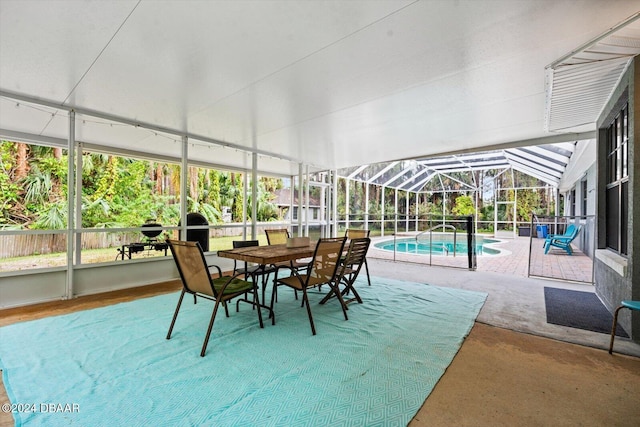 sunroom / solarium with a swimming pool and lofted ceiling