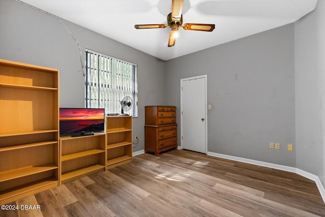 bedroom with wood-type flooring and ceiling fan