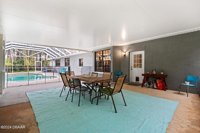 dining space featuring concrete flooring