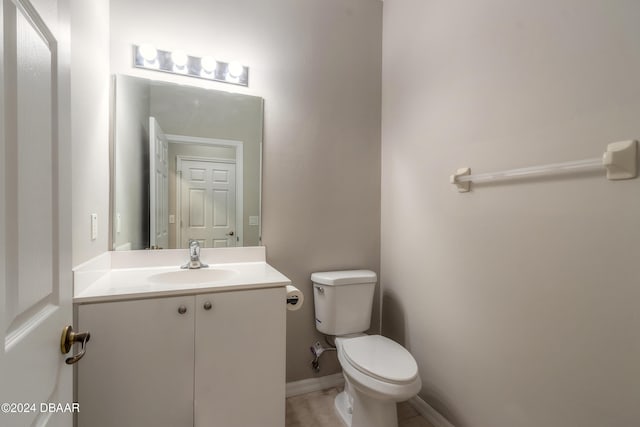 bathroom with toilet and vanity