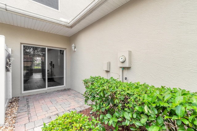 property entrance featuring a patio area