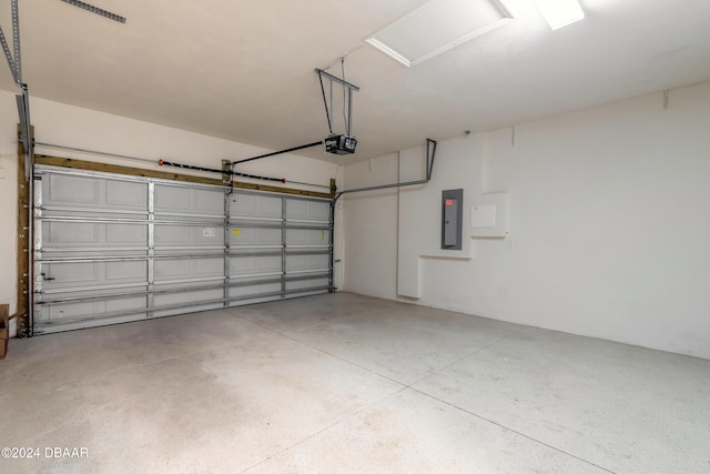 garage with electric panel and a garage door opener