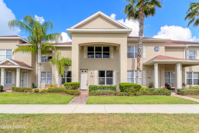 view of front of home with a front lawn