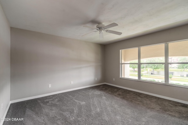 empty room featuring carpet flooring and ceiling fan