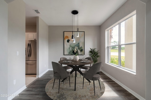 dining room with dark wood-type flooring