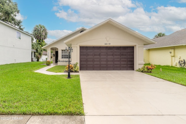 ranch-style house featuring a garage and a front yard