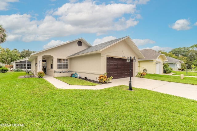 ranch-style home featuring a garage and a front yard