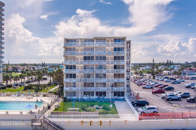 view of building exterior with a community pool