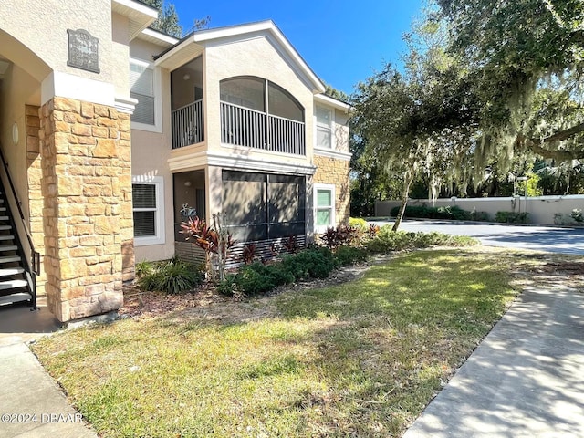 view of property exterior with a lawn