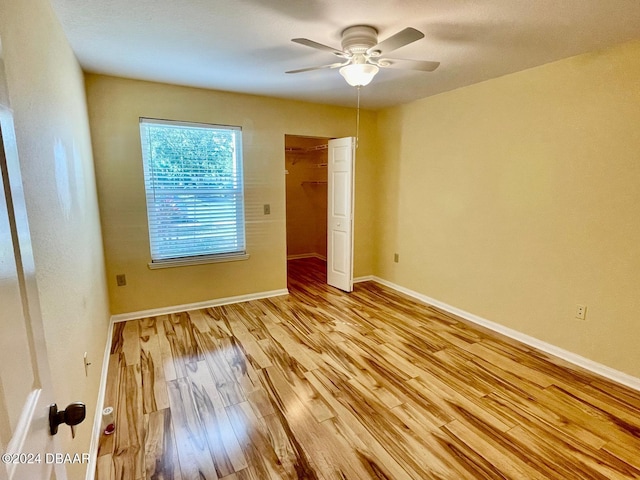 unfurnished room with light hardwood / wood-style floors and ceiling fan