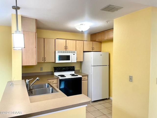 kitchen with hanging light fixtures, sink, light tile patterned flooring, light brown cabinets, and white appliances