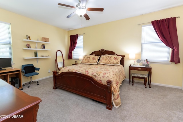 carpeted bedroom with baseboards and ceiling fan