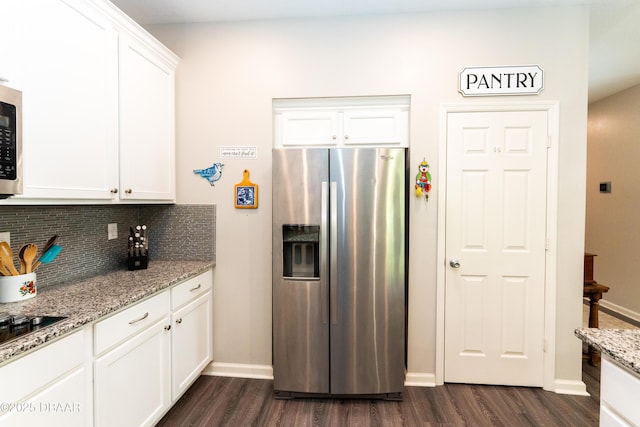 kitchen with backsplash, light stone countertops, dark wood finished floors, stainless steel refrigerator with ice dispenser, and white cabinets