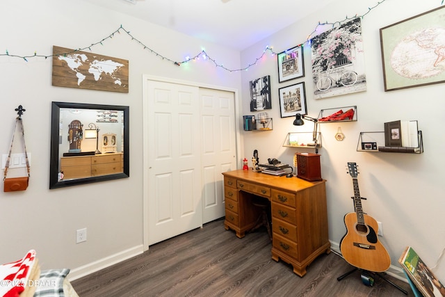 home office with baseboards and dark wood-style flooring