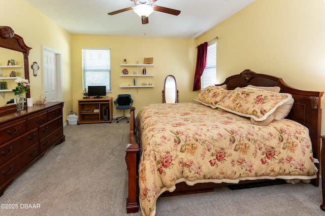 carpeted bedroom featuring ceiling fan