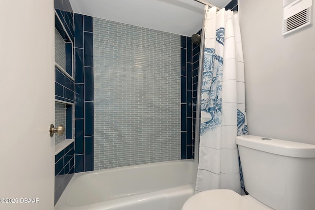 bathroom featuring shower / bathtub combination with curtain and toilet