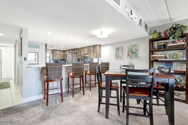 view of carpeted dining area