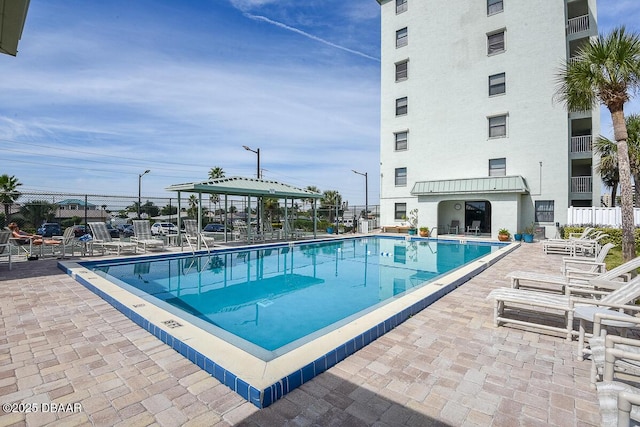 view of swimming pool with a gazebo and a patio area