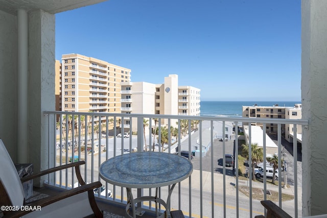 balcony featuring a water view