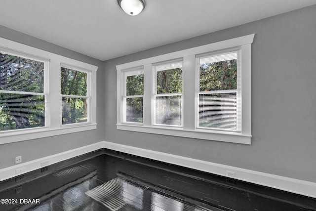 unfurnished sunroom featuring plenty of natural light