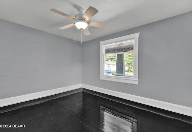 empty room featuring ceiling fan and wood-type flooring