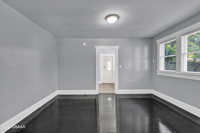 spare room featuring wood-type flooring