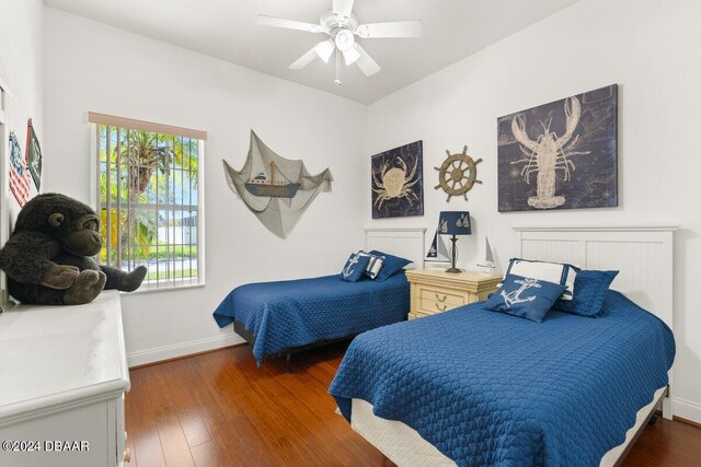 bedroom featuring dark wood-type flooring and ceiling fan