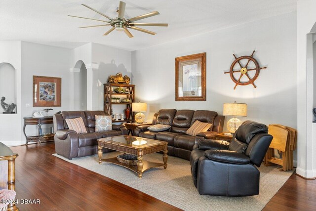 living room with wood-type flooring and ceiling fan