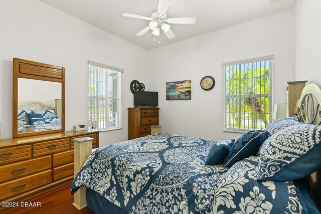 bedroom with wood-type flooring and ceiling fan