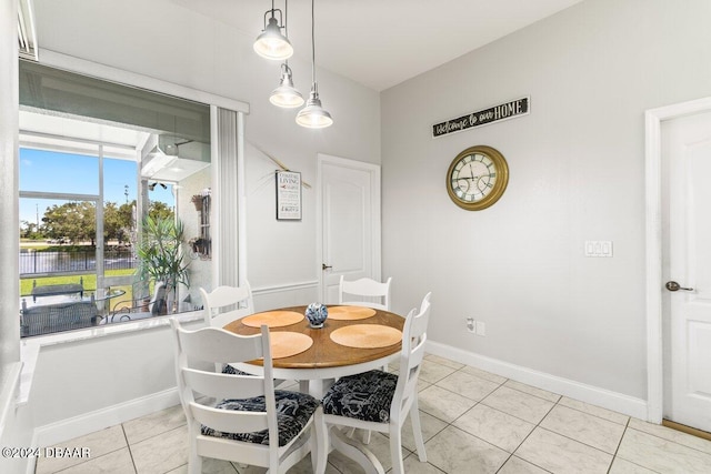 dining area with light tile patterned floors