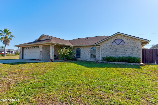 view of front of property featuring a garage, brick siding, a front yard, and fence