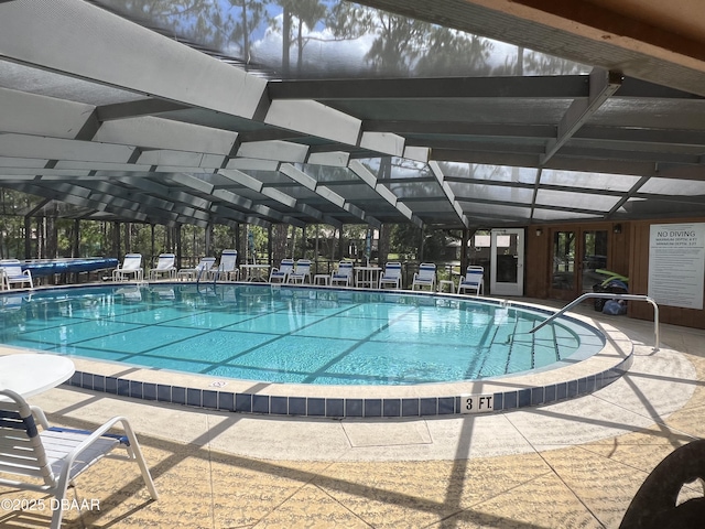 112 Underbrush Trl, Port Orange, FL 32128 - indoor pool featuring glass enclosure and a patio
