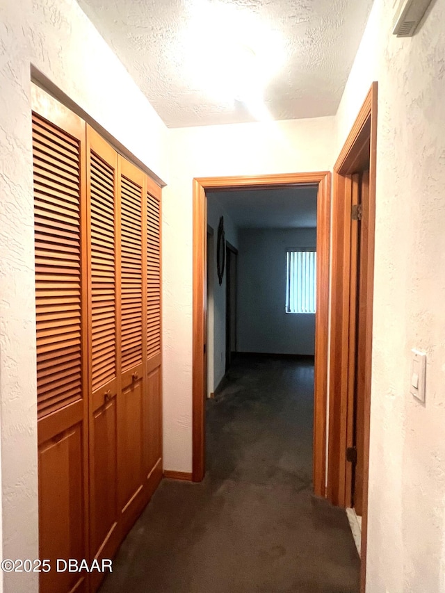 112 Underbrush Trl, Port Orange, FL 32128 - hallway with dark colored carpet, a textured ceiling, and a textured wall