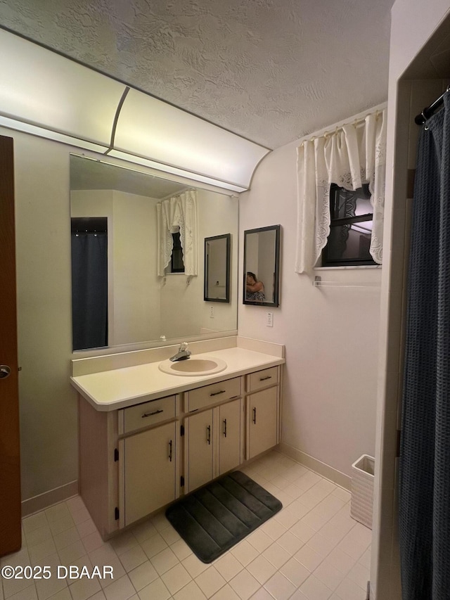 112 Underbrush Trl, Port Orange, FL 32128 - bathroom with vanity, a textured ceiling, and tile patterned flooring