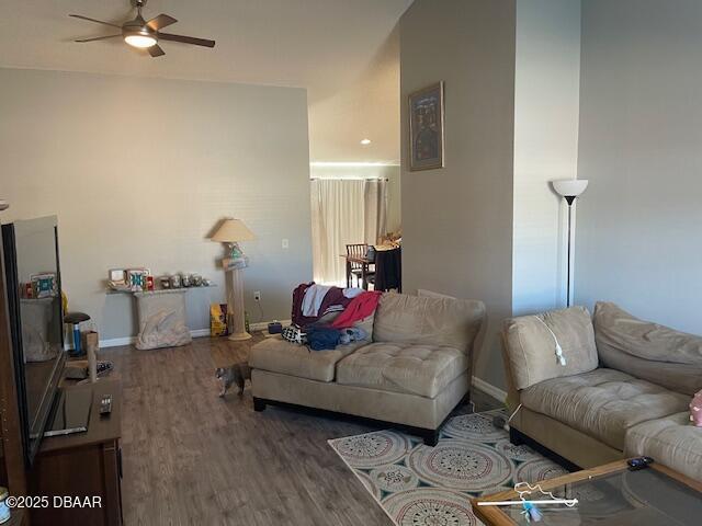 living room with hardwood / wood-style floors and ceiling fan