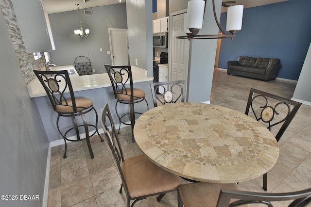 3455 Saddleback Ct, Port Orange, FL 32129 - dining room with baseboards and a chandelier