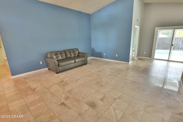 3455 Saddleback Ct, Port Orange, FL 32129 - unfurnished room with high vaulted ceiling and baseboards