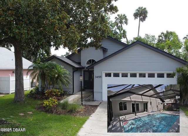 3455 Saddleback Ct, Port Orange, FL 32129 - ranch-style house featuring a garage and an outdoor pool