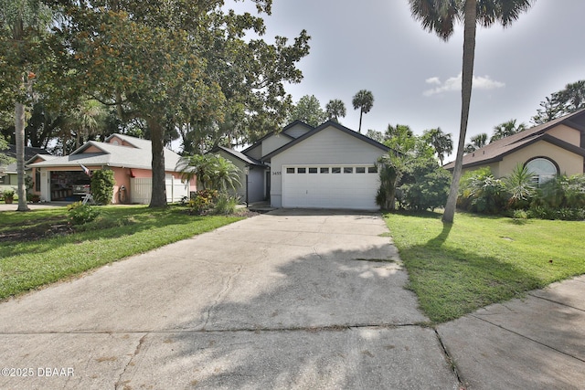 3455 Saddleback Ct, Port Orange, FL 32129 - ranch-style home featuring concrete driveway, an attached garage, and a front yard