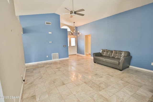 3455 Saddleback Ct, Port Orange, FL 32129 - unfurnished room with a ceiling fan, a chandelier, baseboards, high vaulted ceiling, and marble finish flooring