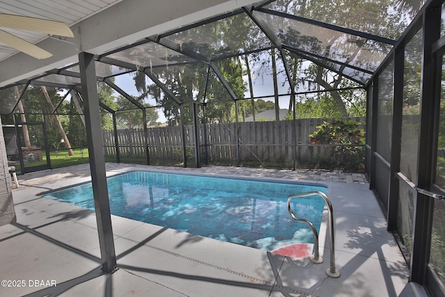 3455 Saddleback Ct, Port Orange, FL 32129 - view of swimming pool featuring a fenced backyard, a patio, and glass enclosure