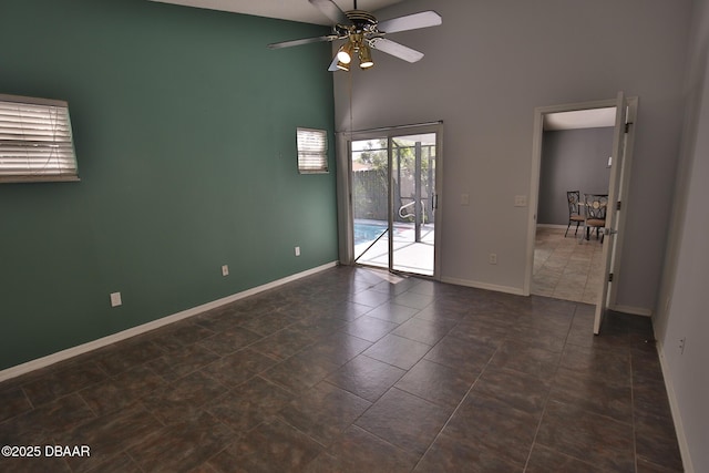 3455 Saddleback Ct, Port Orange, FL 32129 - unfurnished room featuring a towering ceiling, baseboards, and ceiling fan