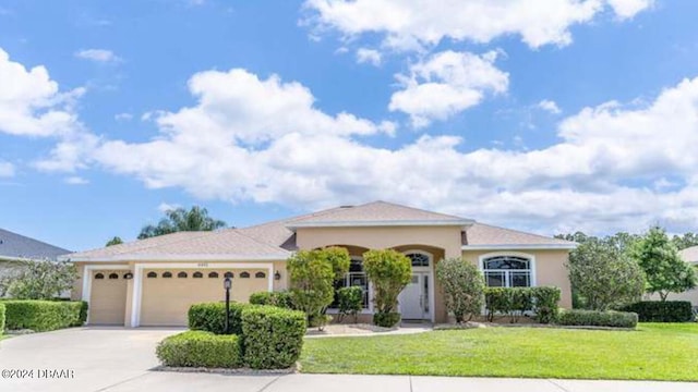 ranch-style house with a front lawn and a garage