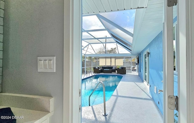 pool featuring a lanai and a patio area