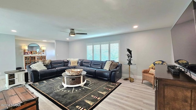 living room with baseboards, ceiling fan, recessed lighting, and light wood-style floors